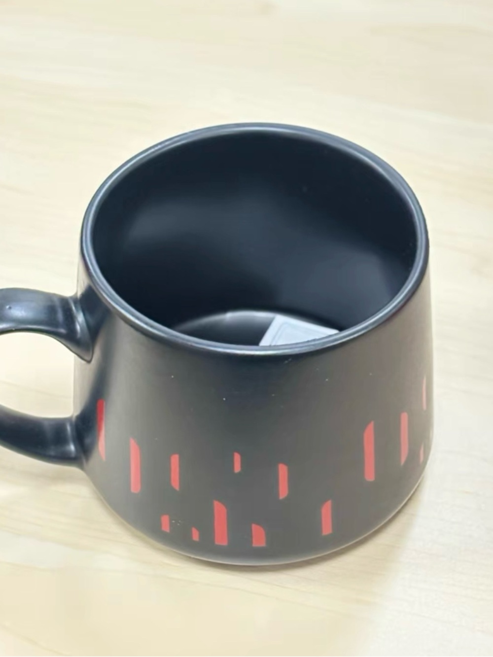 Matte Black Ceramic Mug with Red Accent Pattern